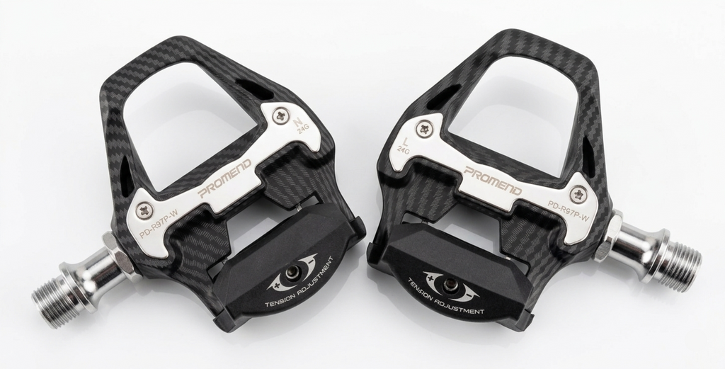 Detailed top-down close-up view of the Promend PD-R97P W road bike pedals on a white background, highlighting the carbon fiber texture finish and silver stainless steel wear plates.