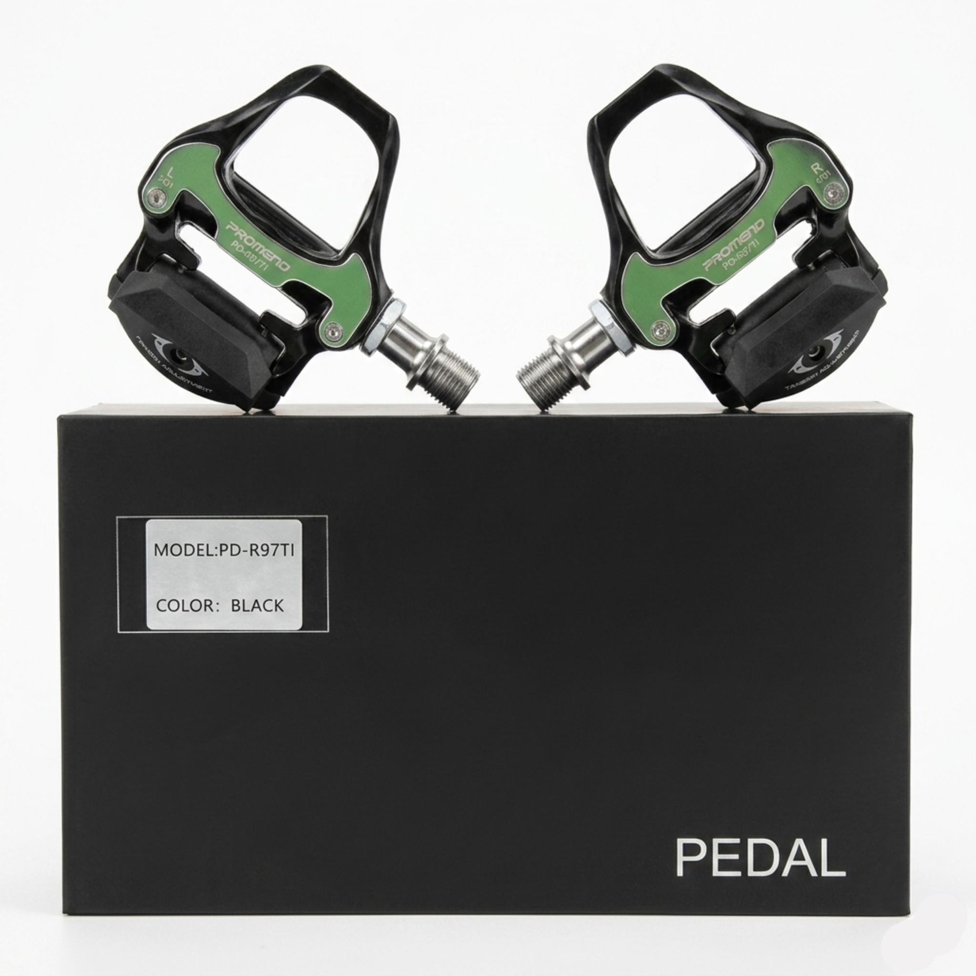 A pair of left and right Promend PD-R97TI metallic silver aluminum road cycling clipless pedals, sitting on top of their original black retail box displaying the model name and titanium axle badge.