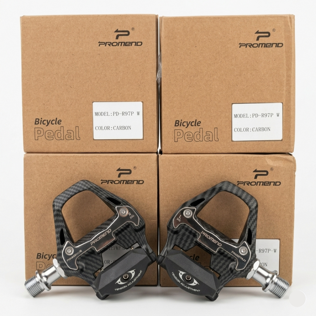 Front-facing view of a pair of black Promend PD-R97P W road bicycle pedals with a carbon fiber weave pattern, resting symmetrically against four brown retail boxes.
