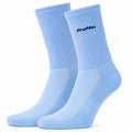Pair of ProMax light sky blue aero cycling socks with black logo on a white background.