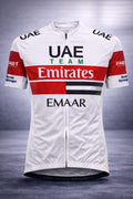 Front view of the white UAE Team Emirates short sleeve cycling jersey featuring a full-length zipper, red and black chest bands, and prominent UAE Team Emirates and EMAAR sponsor logos.