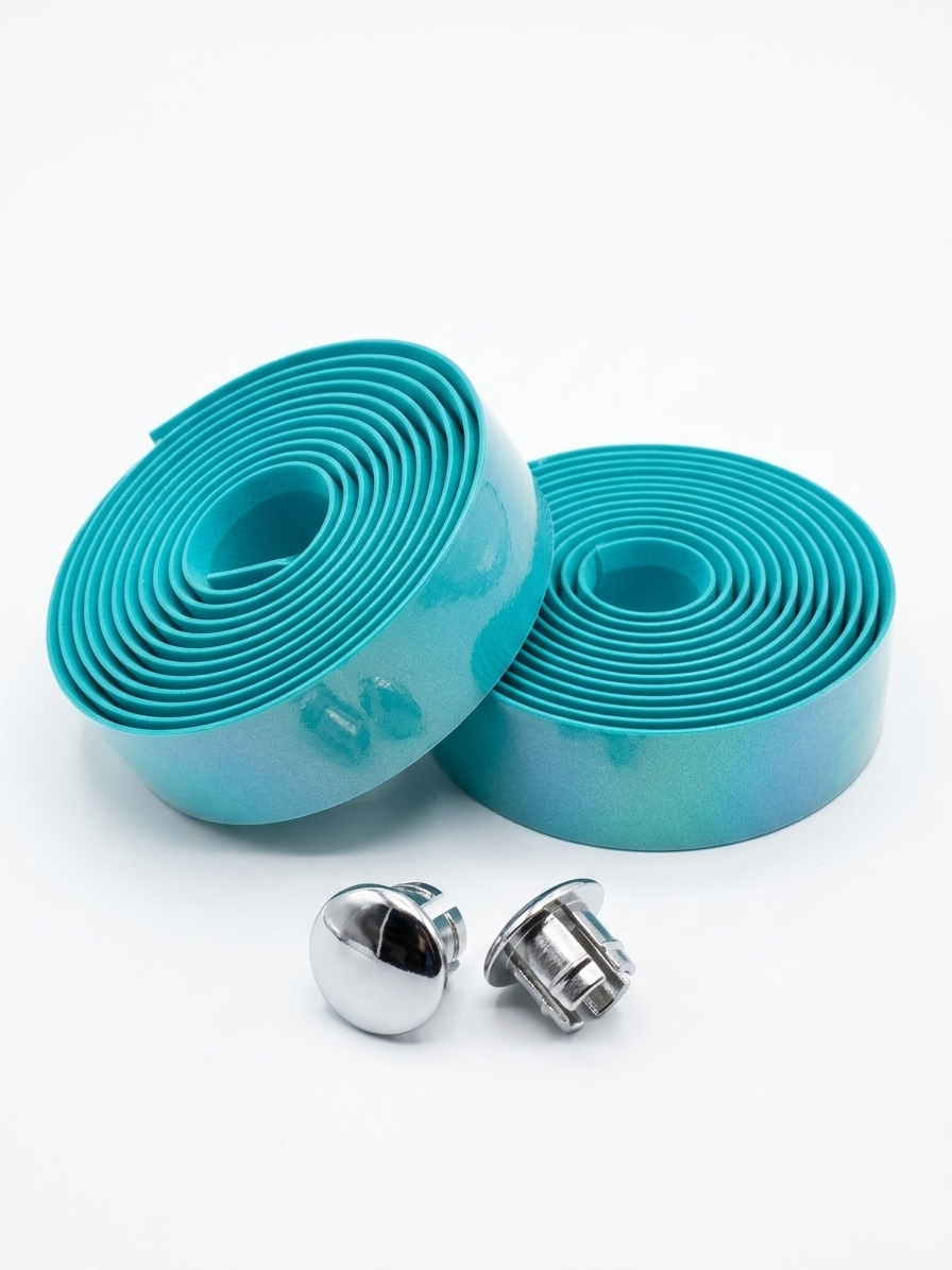 Two rolls of premium celeste teal bicycle handlebar tape displayed alongside two metallic chrome handlebar end plugs on a clean white background