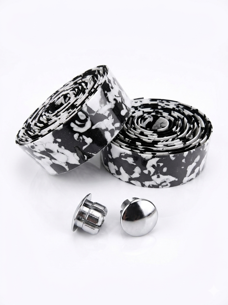 Two rolls of black and white splash pattern bicycle handlebar tape next to two shiny chrome bar end plugs on a white background.