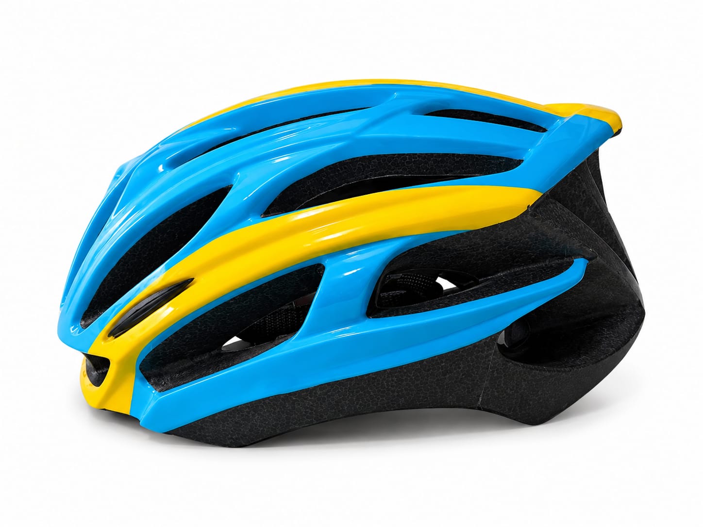 A side profile view of a streamlined road cycling helmet featuring a glossy electric blue outer shell with a bold, swept-back vibrant yellow stripe, revealing a black textured EPS foam liner and internal air ventilation channels, set against a clean white background