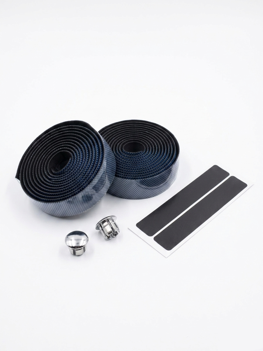 Premium steel blue and dark gray bicycle handlebar tape rolls with a textured micro-dot grid pattern as shown in image, displayed next to two metallic chrome bar end plugs and two black adhesive finishing strips on a clean white background.