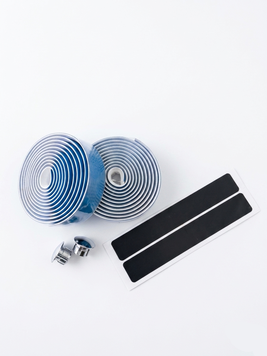 Premium sky blue bicycle handlebar tape rolls with a clean, smooth matte texture as shown in image, displayed alongside two metallic chrome bar end plugs and two black adhesive finishing strips on a bright white background.