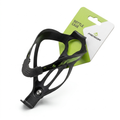 Angled view of a black Merida composite plastic bicycle water bottle cage featuring green graphic accents and a pre-installed silver hex screw, attached to its original green and white cardboard retail header card.