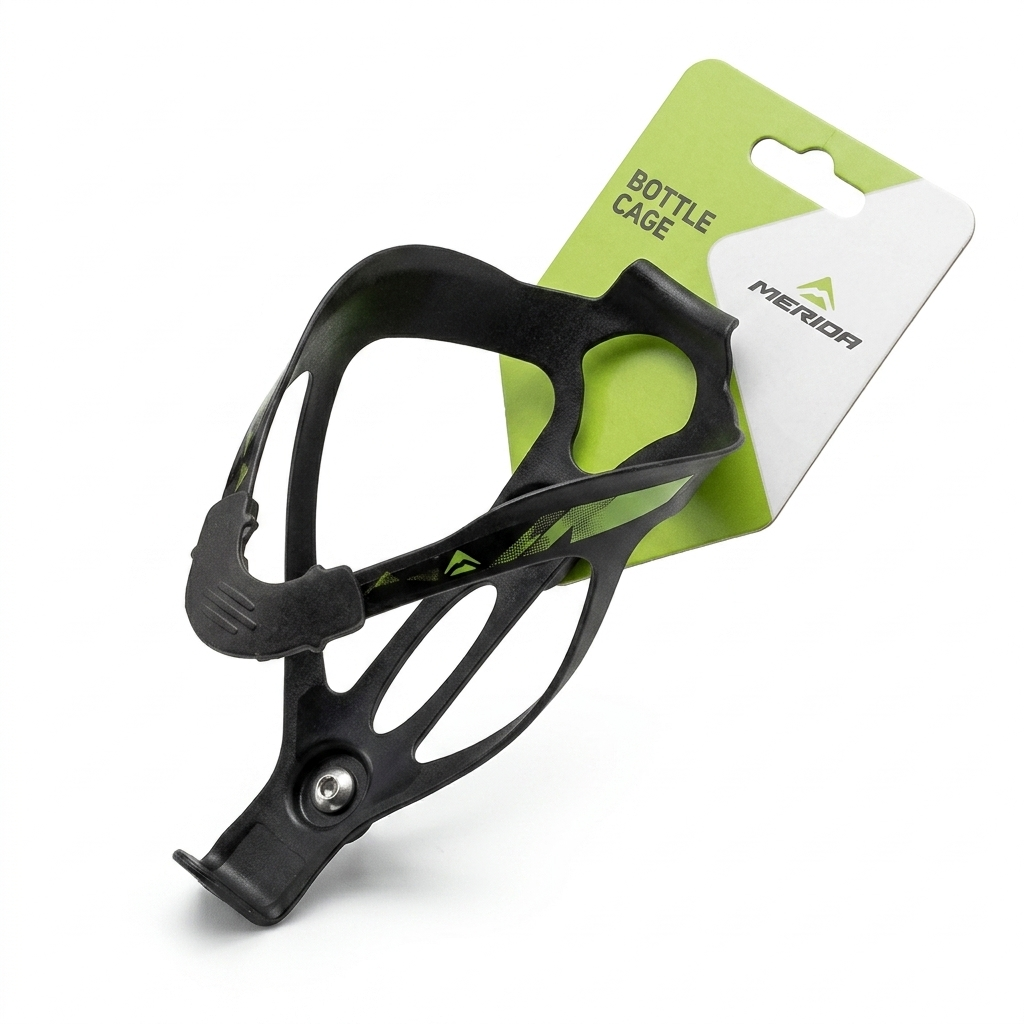 Angled view of a black Merida composite plastic bicycle water bottle cage featuring green graphic accents and a pre-installed silver hex screw, attached to its original green and white cardboard retail header card.