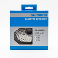 Front view of the blue and silver retail box packaging for the Shimano Claris CS-HG50-8 8-speed road cassette, showing the silver sprockets through a geometric cutout window and a checkmark marked next to the 11-28T ratio.