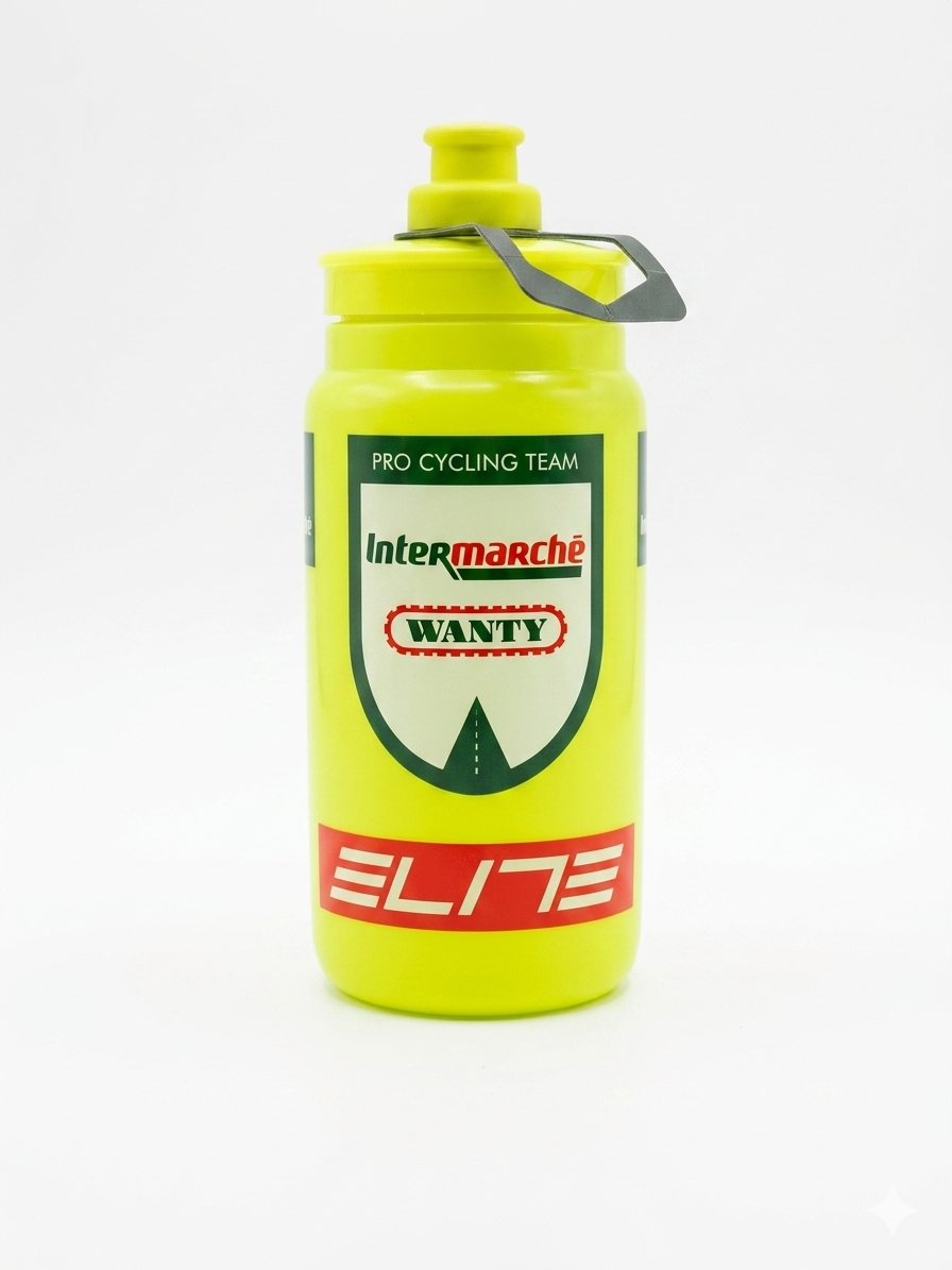 Elite Fly Team Intermarché-Wanty pro cycling water bottle in high-visibility neon yellow featuring the official dark green team crest, Intermarché Wanty logo, and a red Elite brand block.
