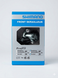 Vertical blue and silver retail box packaging for the Shimano Tiagra FD-4703 3x10 speed front derailleur, showing the component through the geometric cutout window.