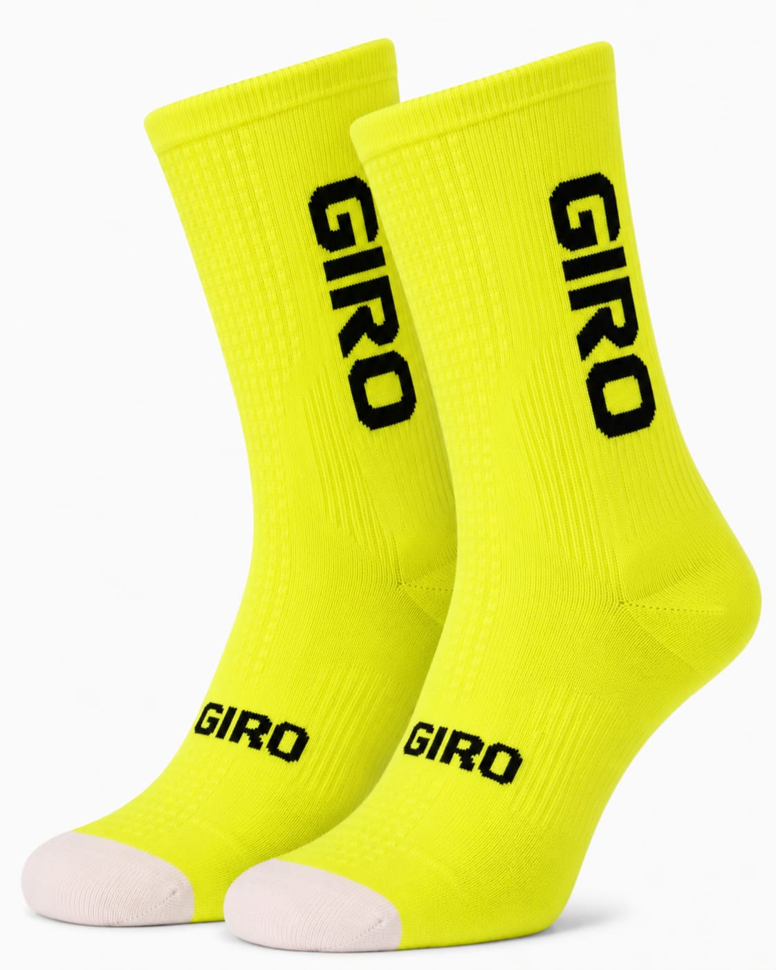 A pair of Giro crew-height performance cycling socks in vibrant high-visibility safety yellow with bold black typography branding and a contrast white toe box, displayed against a plain background.