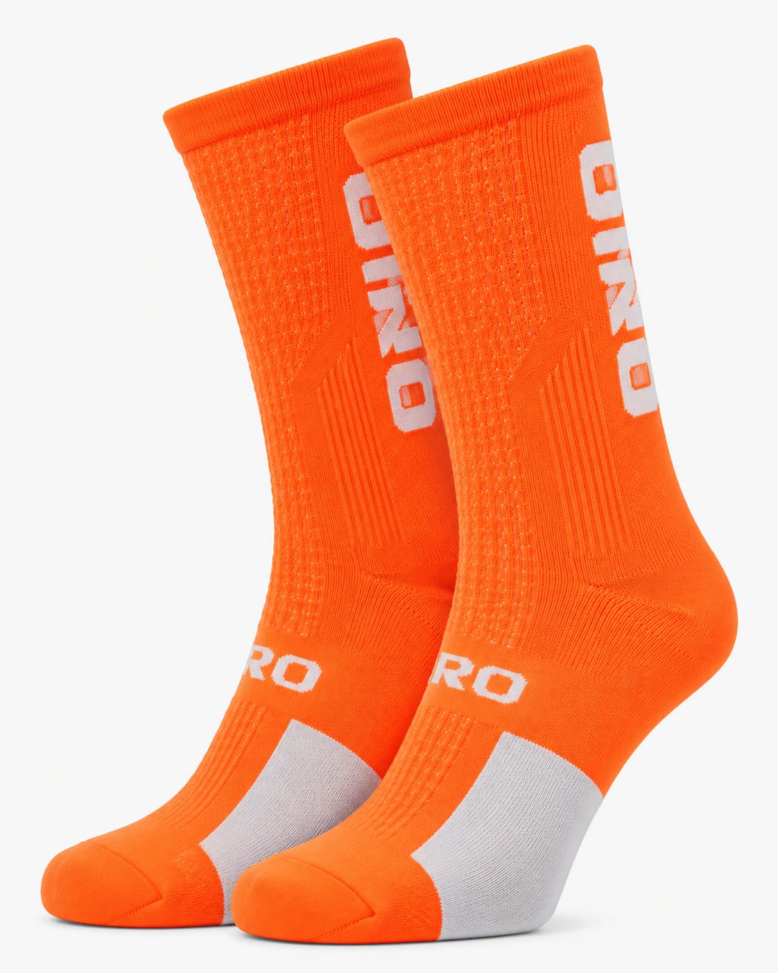 Pair of Giro performance crew-height cycling socks in vibrant safety orange and white, highlighting the breathable mesh knit patterns and supportive arch band against a plain background.