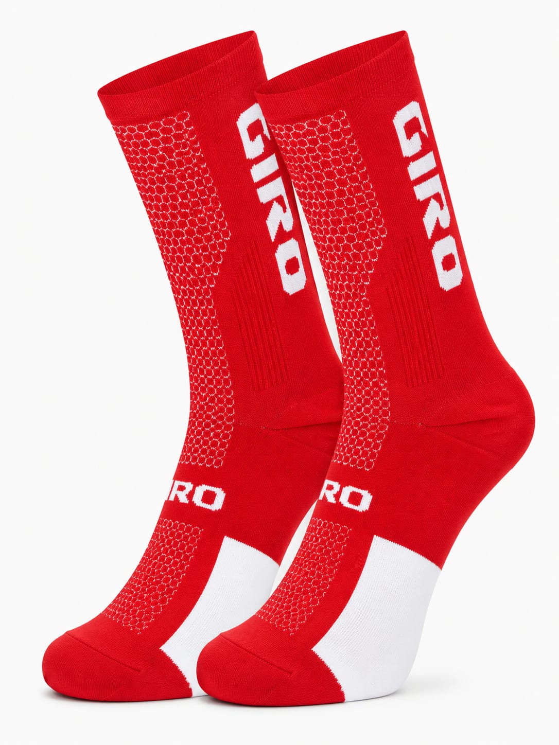 Pair of Giro performance crew-height cycling socks in vibrant racing red and white, displaying high-breathability honeycomb mesh patterns and compression arch support against a plain white background.