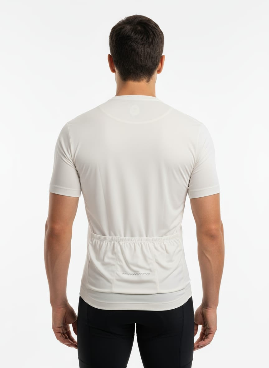 Rear view of a male model wearing the classic white Reeck race fit cycling jersey, highlighting the three elasticated back pockets and a horizontal silver reflective safety strip.