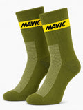 Pair of Mavic performance crew-height cycling socks in a muted olive green, featuring a single horizontal yellow accent stripe at the cuff with black Mavic text branding and a white-flecked mesh ventilation panel on the instep, displayed against a plain background.