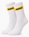 Pair of Mavic performance crew-height cycling socks in crisp classic white, featuring a single prominent horizontal yellow stripe at the cuff with black Mavic text branding, displayed against a plain background.