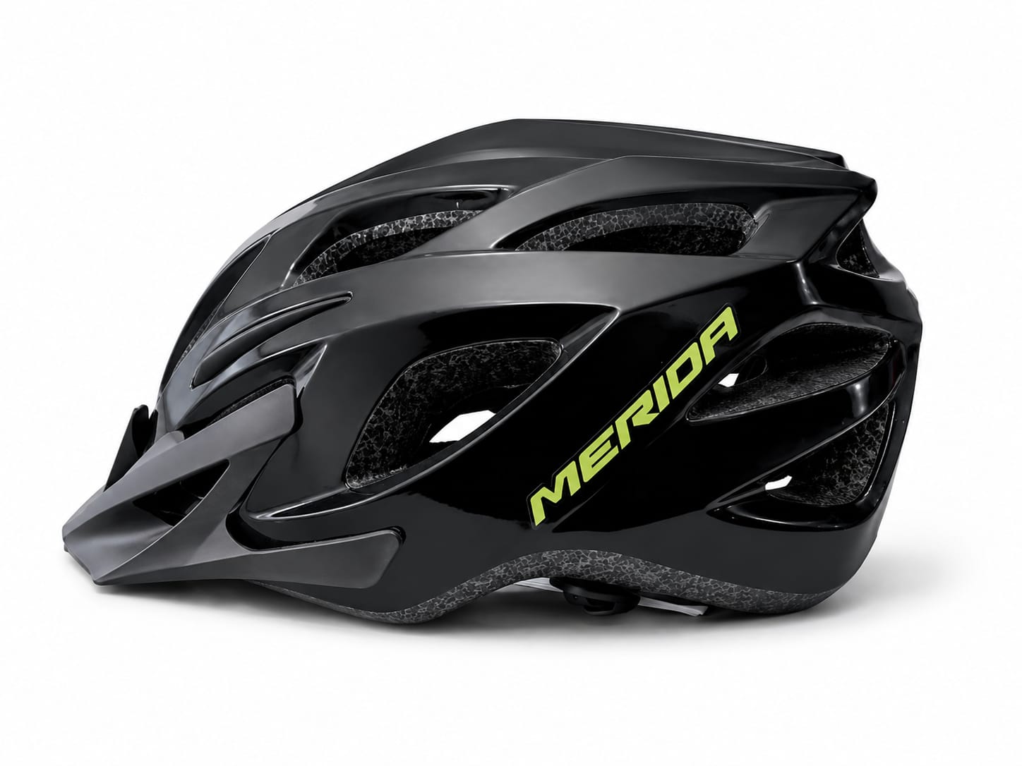Side profile view of a gloss black Merida cycling helmet with neon yellow branding, aerodynamic cooling vents, and an attached front visor against a white background
