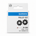 Genuine Shimano 105 and SLX RD-5800 11-speed rear derailleur replacement pulley set featuring two black composite jockey wheels, packaged in an authentic white and blue Shimano retail box with the "SS" version checked.