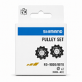 Genuine Shimano Dura-Ace RD-9000 and RD-9070 11-speed rear derailleur replacement pulley set featuring two black composite jockey wheels with sealed bearings, displayed inside its premium white, blue, and gold retail box.
