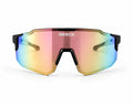 Front view of REECK Prism half-frame sports sunglasses featuring a geometric matte black brow bar and a rimless-bottom shield lens shifting from rose gold to pastel yellow and blue.