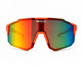 Front view of REECK Prism half-frame sports sunglasses featuring vibrant blaze orange frame accents and an angular, rimless-bottom shield lens with a multi-color rainbow gradient mirror finish.