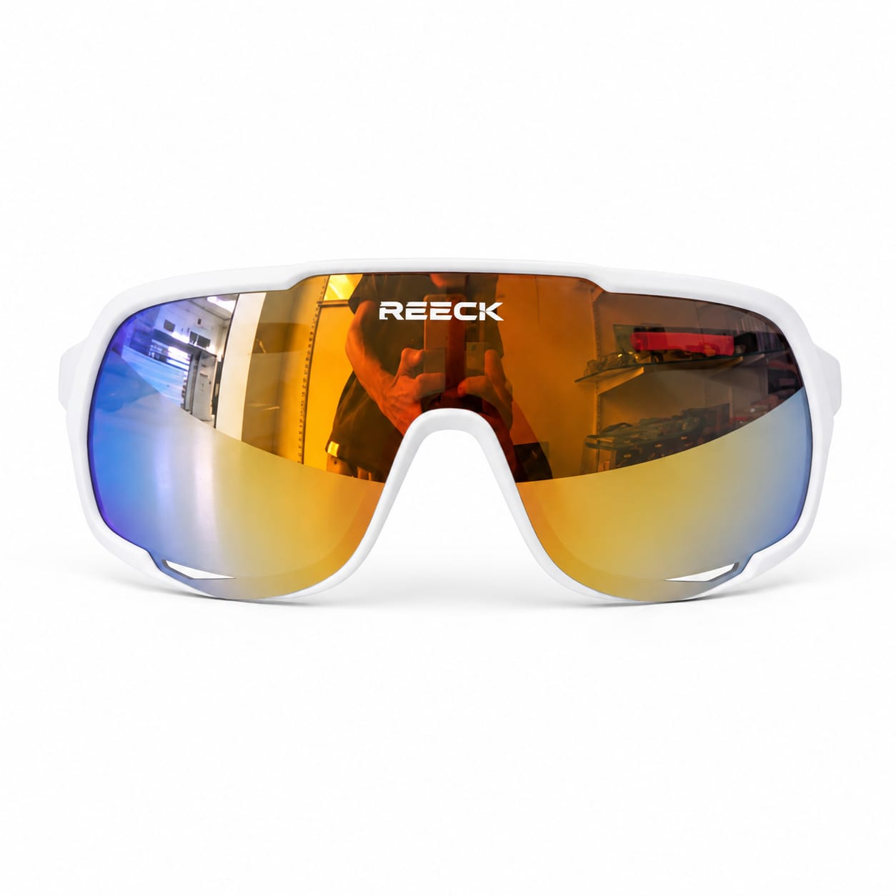Front view of REECK sports sunglasses featuring a crisp white full-rim wraparound frame and a highly reflective gold and orange mirrored shield lens against a plain white background.