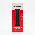 Front view of the vertical white and red retail box packaging for a Vittoria Rubino Pro folding road bike tire, showcasing the black textured tread pattern through the display window and detailing the 700 x 25c advanced training specification.