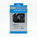 Shimano Sora RD-R3000-SS 9-speed short cage rear derailleur inside its blue and grey original Shimano retail packaging box.