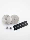 Premium off-white bicycle handlebar tape rolls with a natural cork-speckled pattern as seen in image accompanied by two reflective chrome bar end plugs and two black adhesive finishing strips on a clean white background.