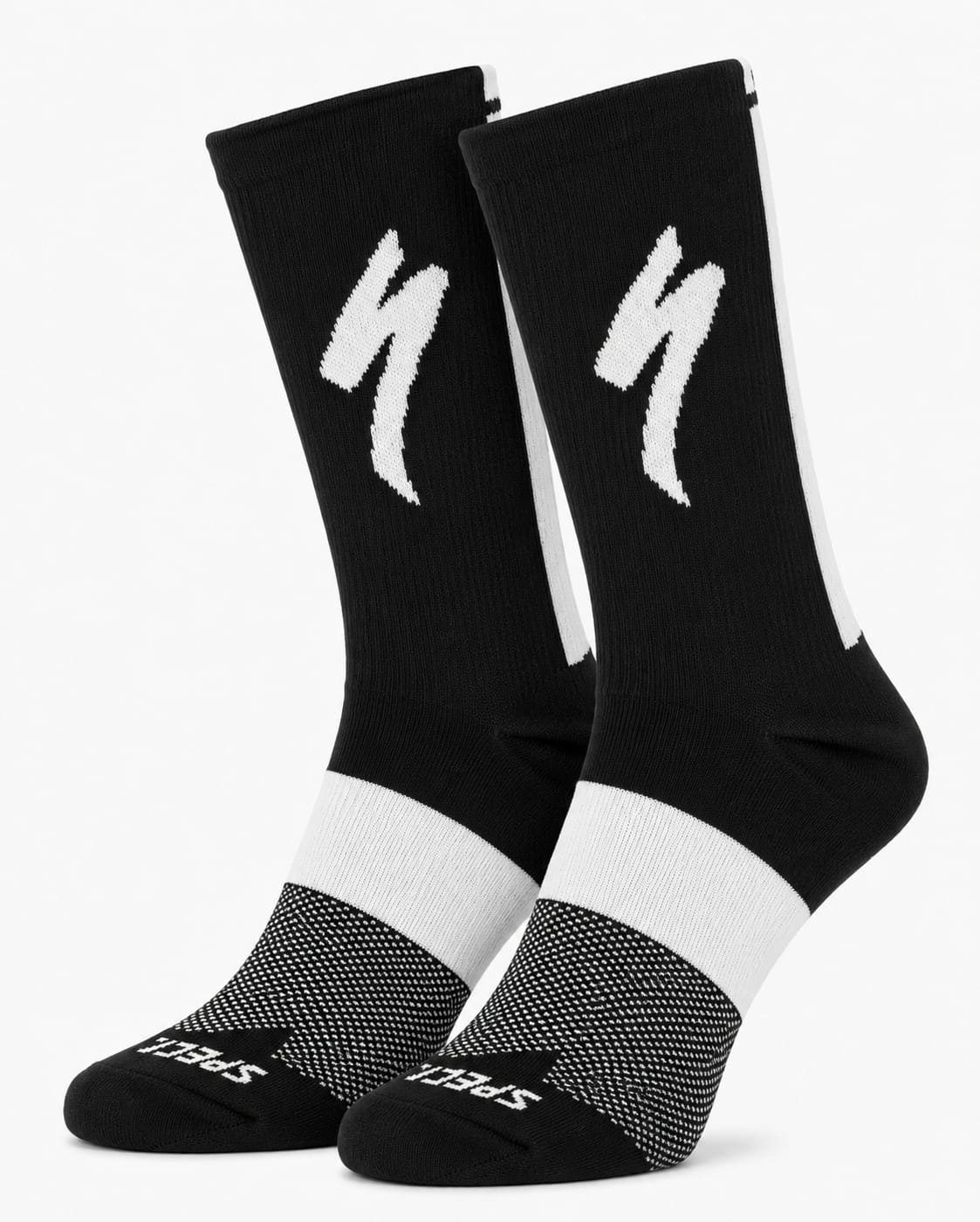 A pair of SPECIALIZED crew cycling socks in a solid black colorway featuring a white midfoot block, a vertical white stripe down the back, and the iconic white lightning bolt logo on the upper cuff, displayed upright against a clean white background