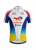 Front studio view of the white Team TotalEnergies short-sleeve cycling jersey, showcasing vibrant blue and yellow side gradients with prominent TotalEnergies and Vendée sponsor logos.