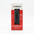Front view of the white and red retail box packaging for a Vittoria Zaffiro Pro folding road bike tire, showcasing the black rubber tread pattern through the display cutout and listing the 700 x 25c tube-type specification.